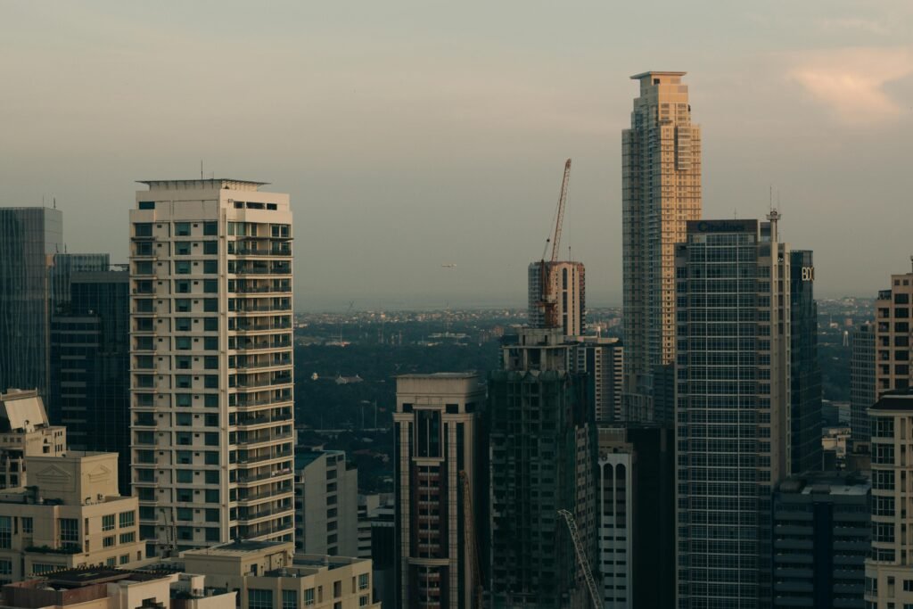 A stunning view of the Makati cityscape featuring tall skyscrapers at twilight.